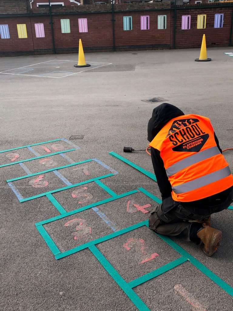 image of a repair of a playground marking