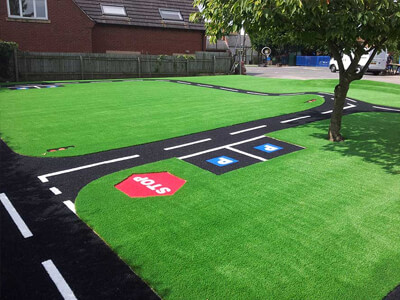 artificial grass and roadway play carpet