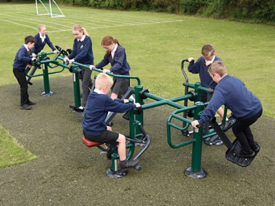 Multi gym equipment for kids. Children using sports and fitness equipment in social fitness setting