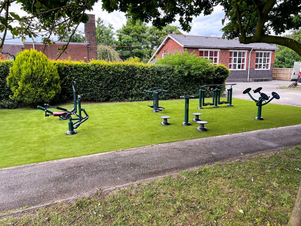 A playground outdoor gym equipment set with multiple pieces of unique exercise options