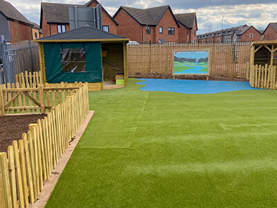 Playground with green artificial grass flooring