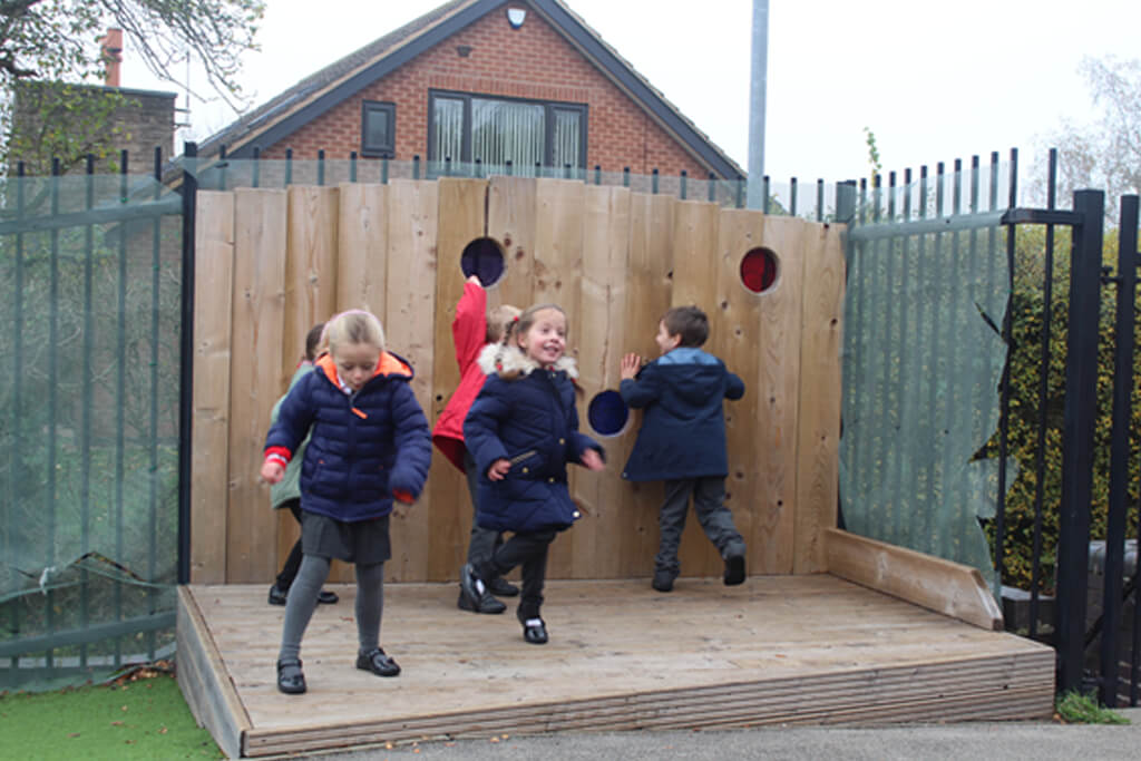 children on wooden play stage