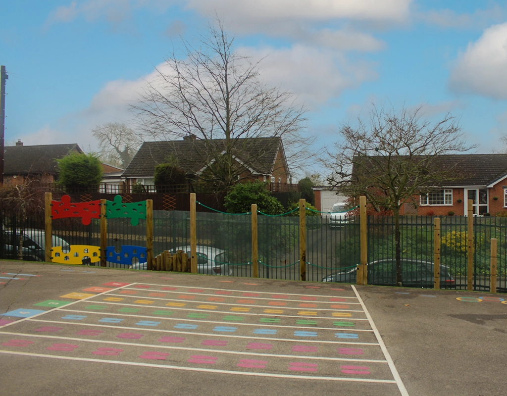School playground with climbing panels and game play markings