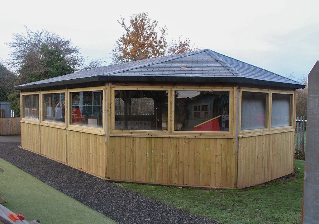 large wooden gazebo with windows