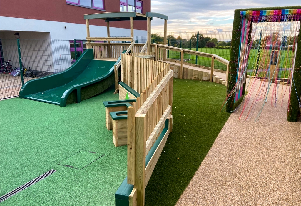 school playground bespoke wooden play slide with colourful sensory archway