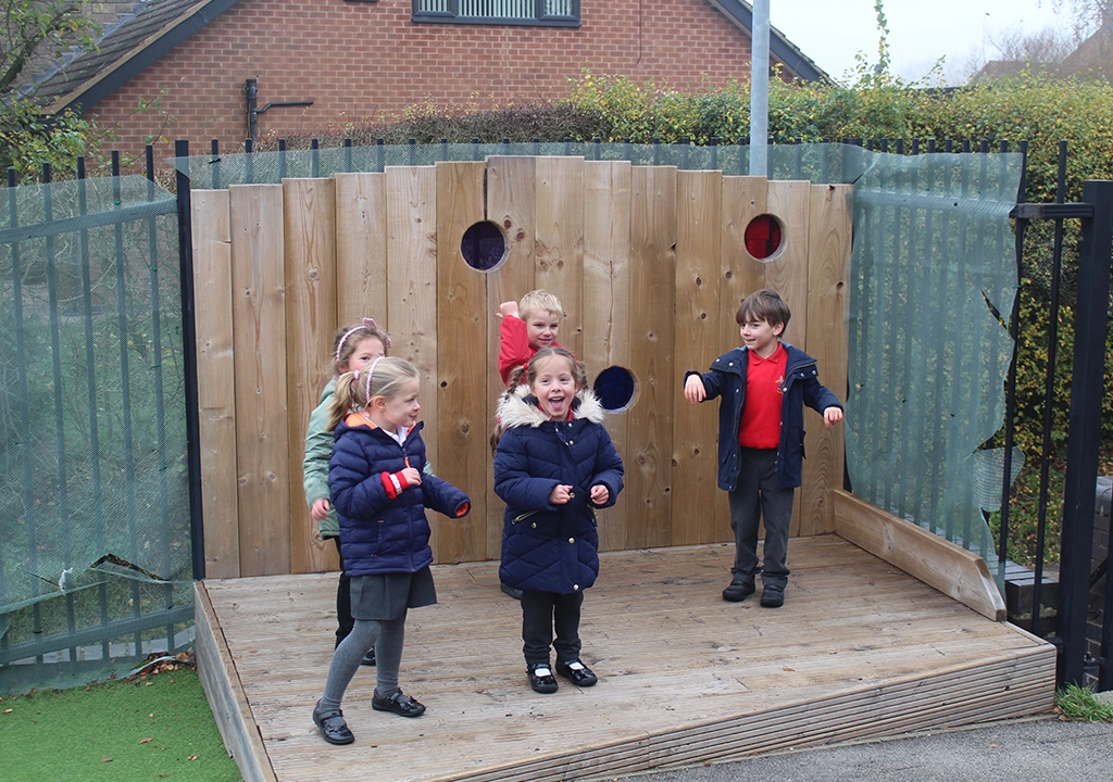 Children enjoying an inclusive outdoor play stage
