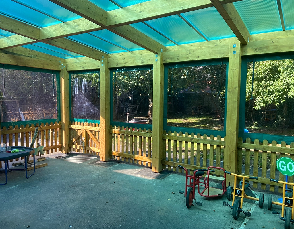 Green roof of perspex canopy bike shed