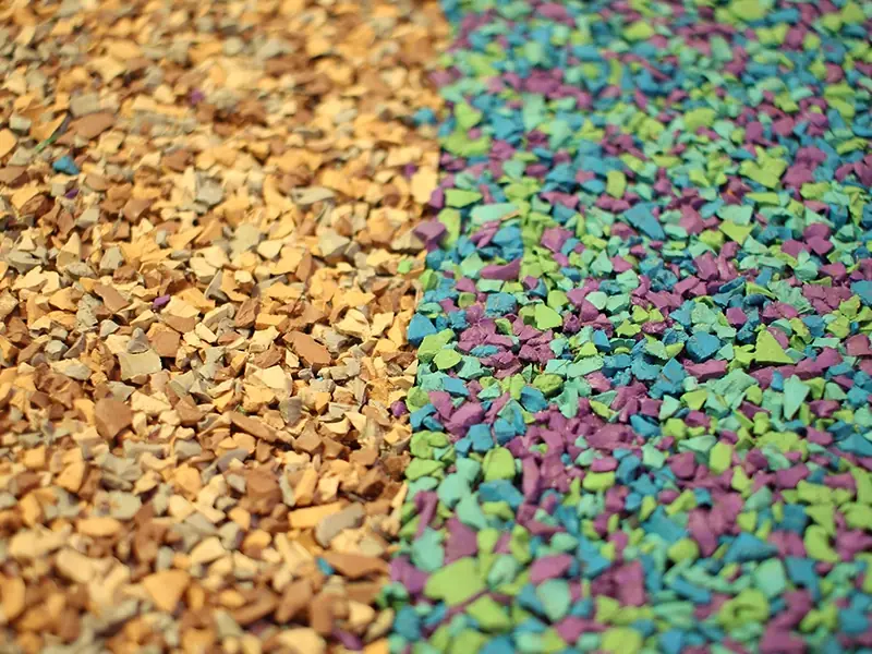 Close-up on Green and Yellow rubber mulch surface stripe