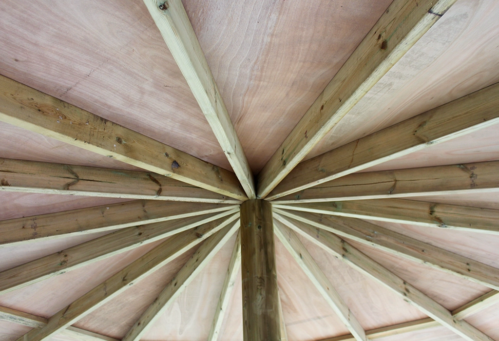 Wooden roof beams in a school outdoor classroom gazebo in a Nottinghamshire school playground