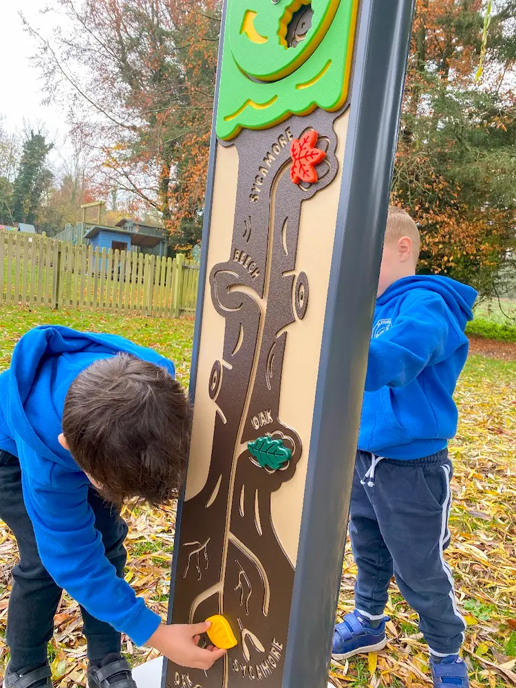 Children Using Freestanding educational play panel leaf match puzzle