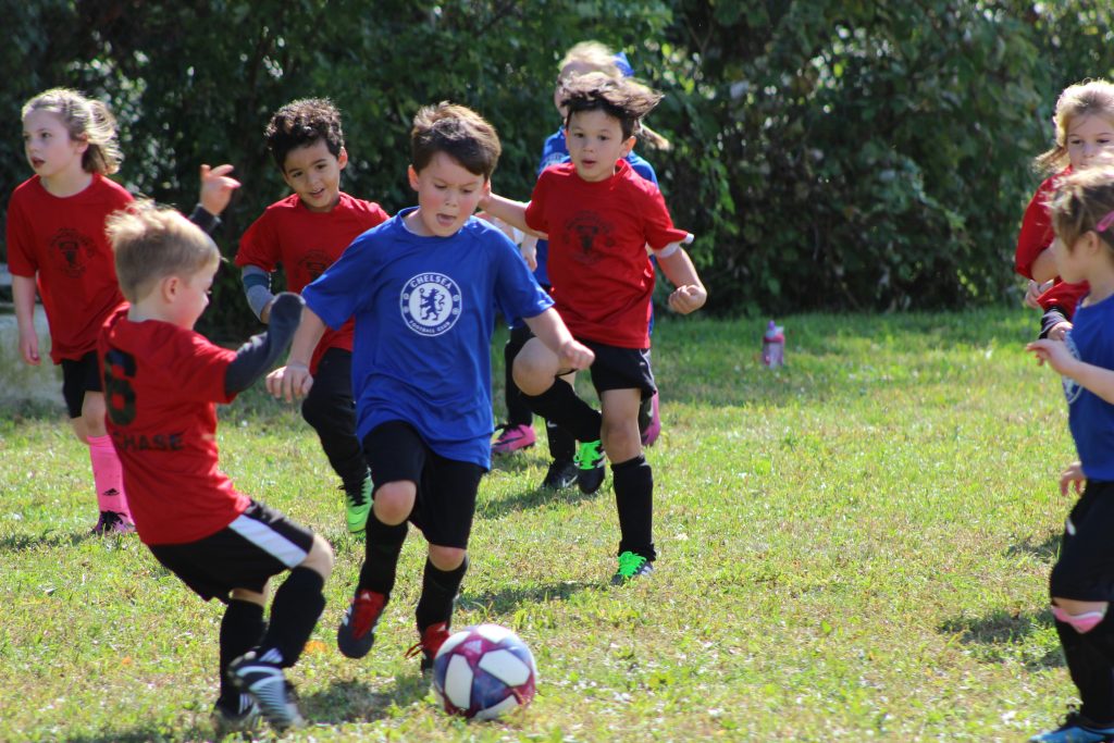 Children playing a game of football