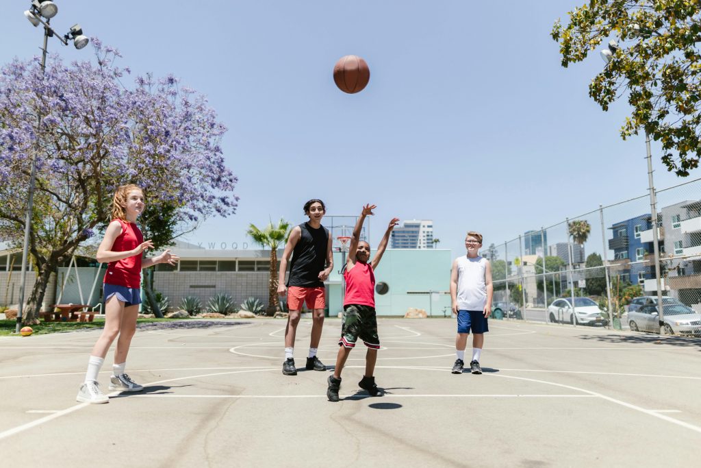 Children playing a game of basketball