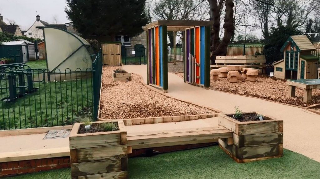 Sensory garden playground with bench planter and colourful sensory archway