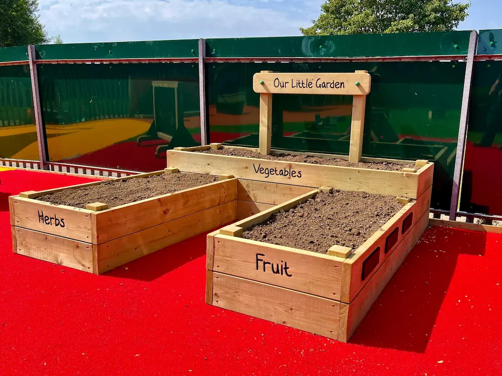 A large planter for fruit, vegetables, and herbs for a children's nature area