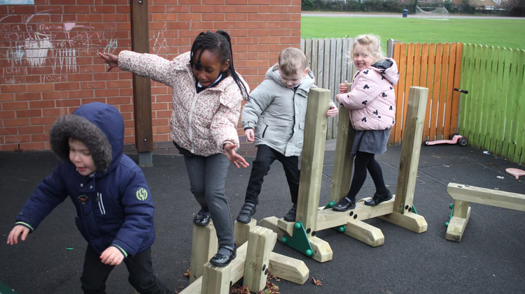 Children enjoying a Free-Standing Trim Trail