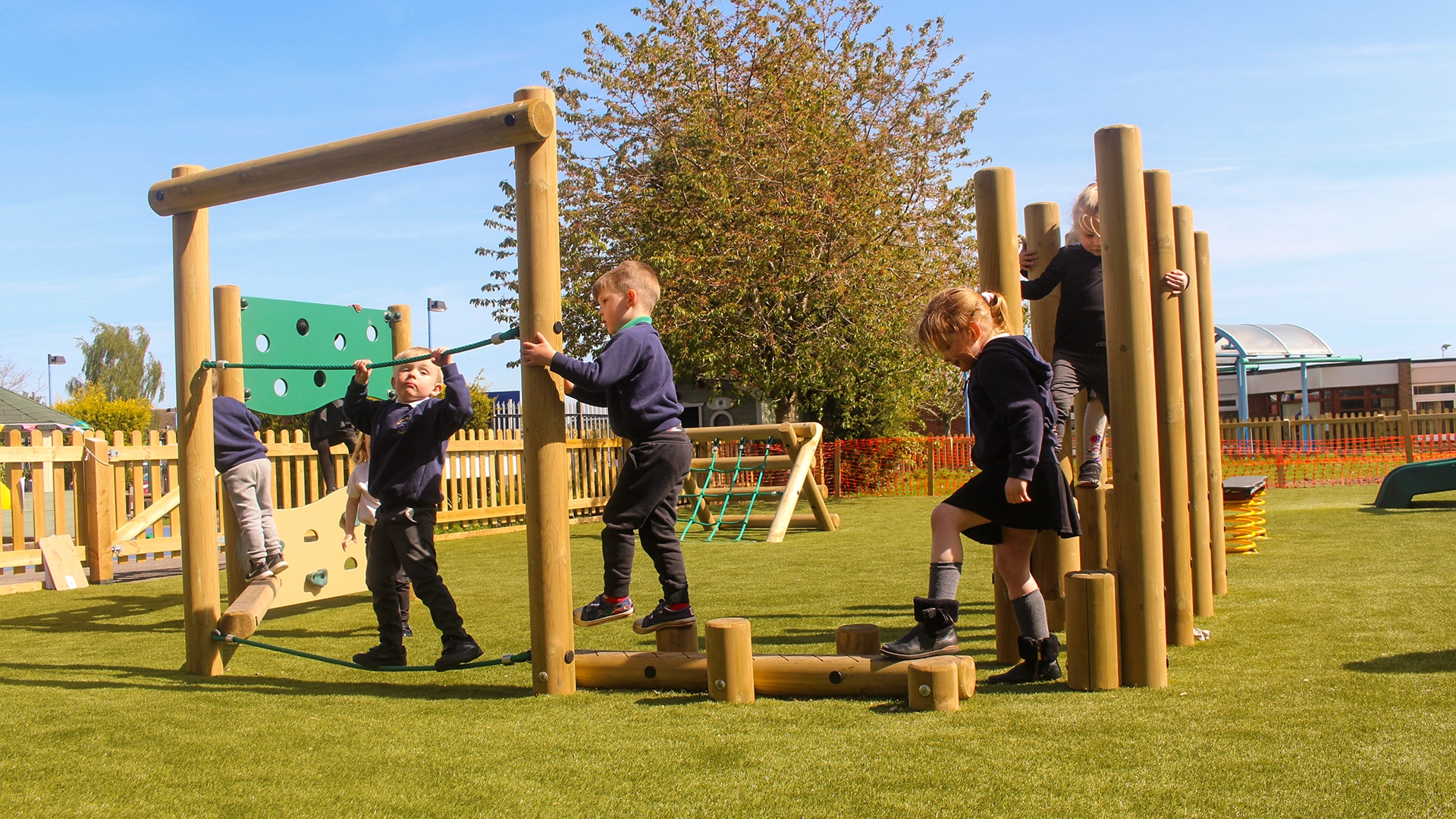 Children using mini trim trail equipment