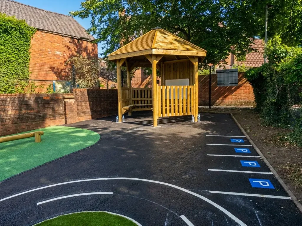 school playground gazebo seating area with car park bay markings