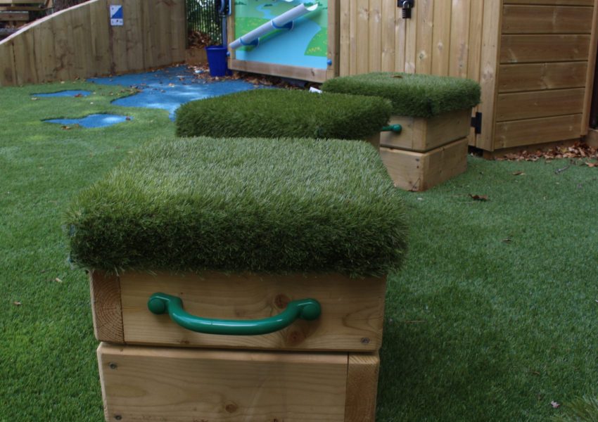 3 grass-topped wooden seating cubes for childrens' storytelling area