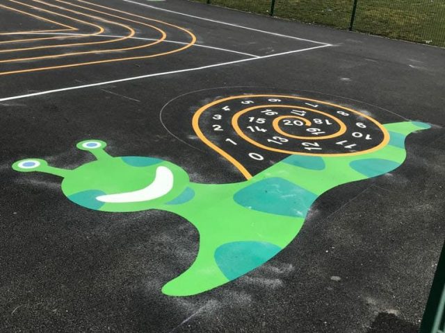 Green snail playground markings with numbers inside the shell