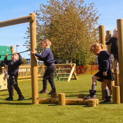 Children using mini trim trail equipment