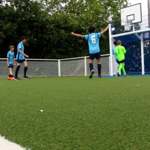 Children playing football on MUGA at Nene Valley