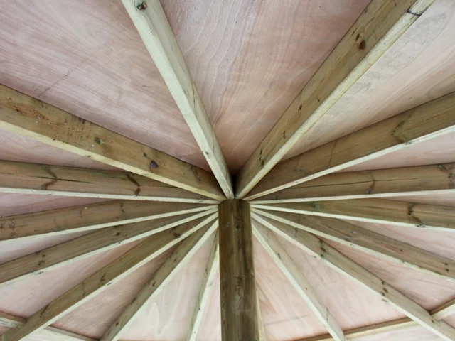 Wooden roof beams in a school outdoor classroom gazebo in a Nottinghamshire school playground