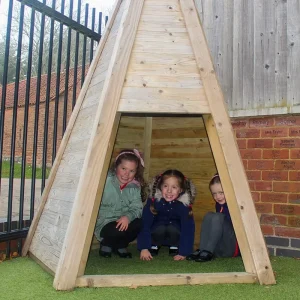 Children in a small wooden tee-pee structure in a Nottinghamshire school playground