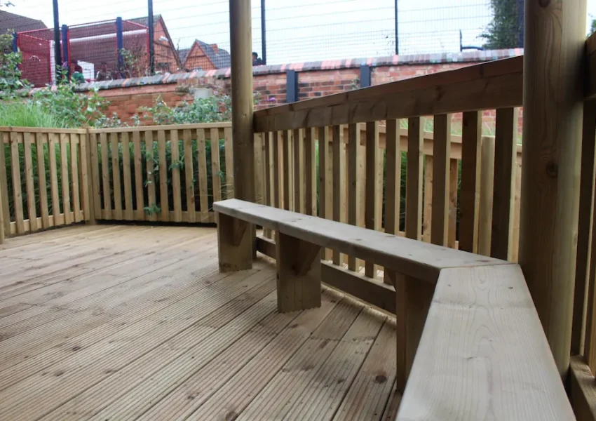 Wooden bench seating in outdoor classroom gazebo
