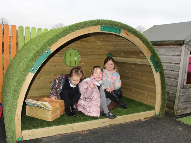 Children reading together in Hobbit House Den