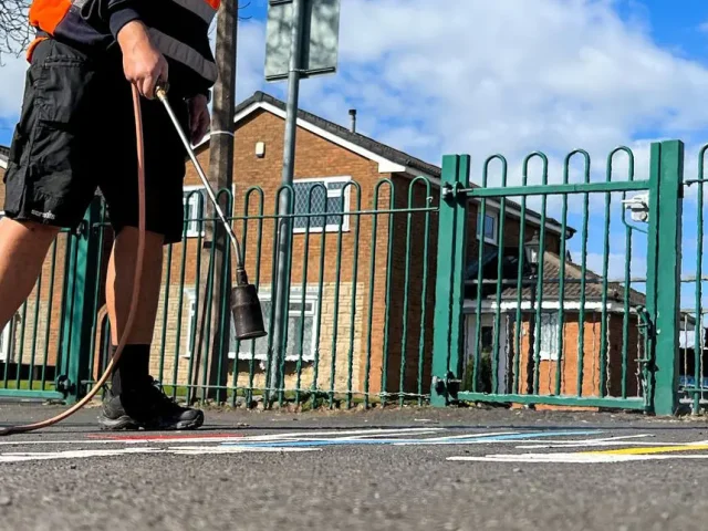 Installation of thermoplastic playground markings on playground