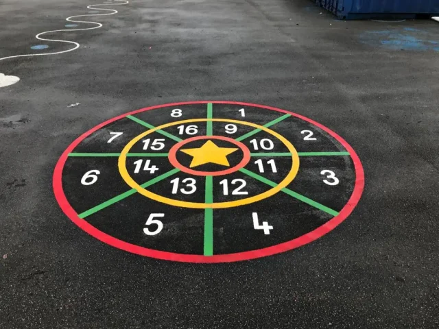 Target game playground markings with star bullseye